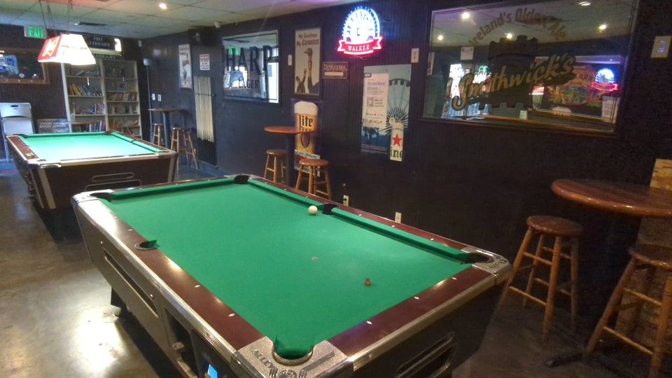 Casual dining room with sports screens.